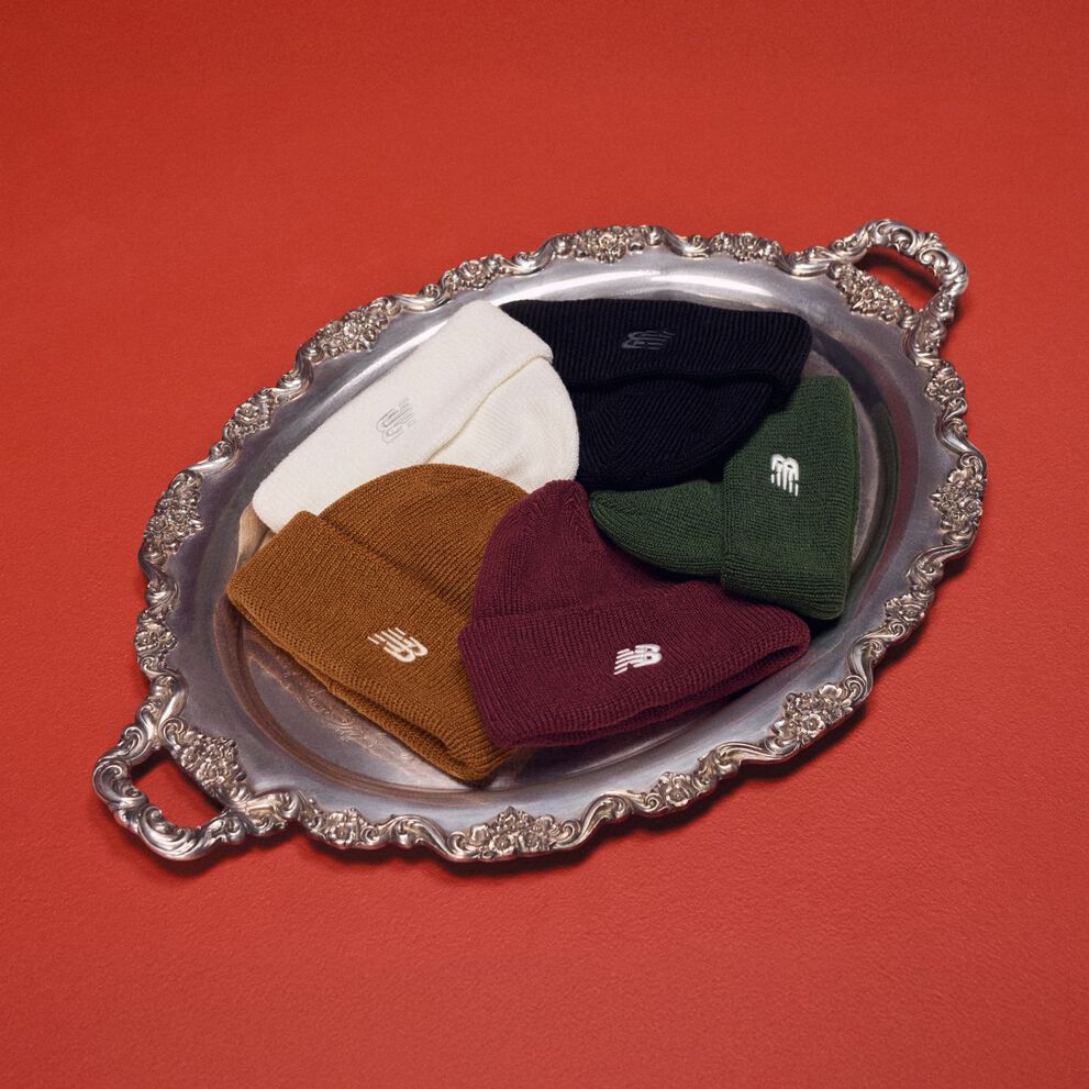 Silver platter holding five different color beanies.