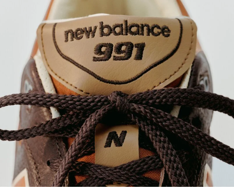 Close up view of a New Balance Made in UK sneaker tongue and laces.  
