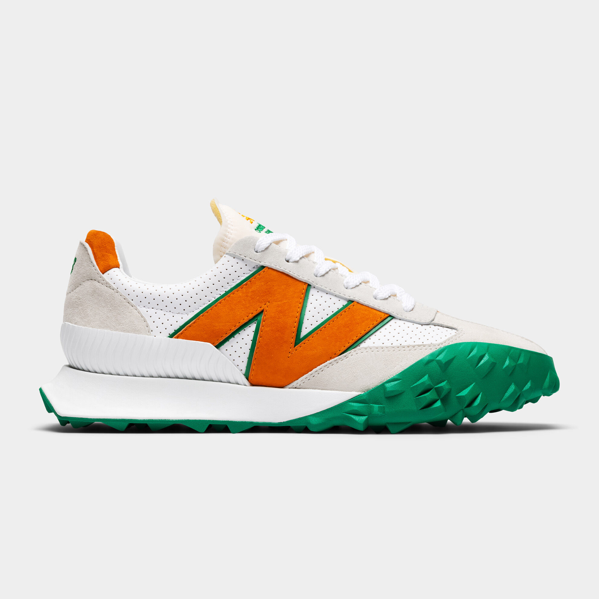 Right side profile of a green and orange XC-72 sneaker