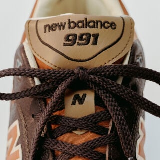 Close up view of a New Balance Made in UK sneaker tongue and laces.  